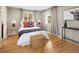 Serene bedroom with light walls, hardwood floors, and warm natural light at 4972 Easley Rd, Golden, CO 80403