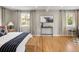 Bright bedroom featuring hardwood floors, neutral walls, and windows that stream in natural light at 4972 Easley Rd, Golden, CO 80403