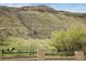 Scenic landscape with rolling hills and horse in fenced in area at 4972 Easley Rd, Golden, CO 80403