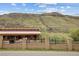 Rural landscape featuring fenced in horses and mountainous views at 4972 Easley Rd, Golden, CO 80403