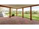 Covered patio with stone flooring and views of the landscaped backyard at 4972 Easley Rd, Golden, CO 80403