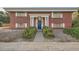 Attractive brick building with a blue front door and walkway at 450 W Jefferson Ave, Englewood, CO 80110