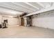 Large unfinished basement with insulated walls, utility equipment, and ample space for storage or customization at 431 Courtfield Way, Castle Pines, CO 80108