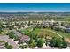 Neighborhood homes surrounded by green spaces and landscape against a backdrop of distant mountains at 4385 Oakes Mill Ct, Castle Rock, CO 80109