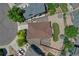Aerial view of home, showcasing roof, driveway, patio, and lush surrounding landscape at 4385 Oakes Mill Ct, Castle Rock, CO 80109