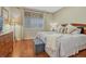 Relaxing bedroom with hardwood flooring, soft lighting, and stylish furnishings at 4385 Oakes Mill Ct, Castle Rock, CO 80109