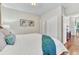 Comfortable bedroom showcasing a plush bed and access to closet space at 4385 Oakes Mill Ct, Castle Rock, CO 80109