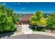 Charming home with manicured lawn, mature trees, and a freshly paved driveway at 4385 Oakes Mill Ct, Castle Rock, CO 80109