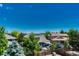 Neighborhood home featuring trees, fenced yard, covered patio, and beautiful landscape at 4385 Oakes Mill Ct, Castle Rock, CO 80109