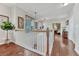Bright and open foyer with hardwood floors and staircase leading to living spaces at 4385 Oakes Mill Ct, Castle Rock, CO 80109