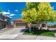 Charming brick home featuring a well-manicured front yard and an attached two-car garage at 4385 Oakes Mill Ct, Castle Rock, CO 80109