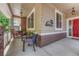 Cozy front porch with comfortable seating, decorative lighting, and stylish accents at 4385 Oakes Mill Ct, Castle Rock, CO 80109