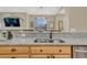 Bright kitchen features a granite countertop and stainless steel sink at 4385 Oakes Mill Ct, Castle Rock, CO 80109