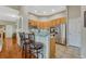 Modern kitchen with granite countertops, stainless steel appliances, and bar seating at 4385 Oakes Mill Ct, Castle Rock, CO 80109