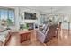 Spacious living room with a fireplace, comfortable seating, and ample natural light at 4385 Oakes Mill Ct, Castle Rock, CO 80109
