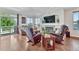 Comfortable living room featuring hardwood floors, a fireplace, and a sliding glass door at 4385 Oakes Mill Ct, Castle Rock, CO 80109
