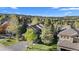 Gorgeous home with mature trees, complemented by views of the mountains and clear blue skies at 24005 High Meadow Dr, Golden, CO 80401