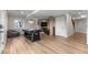 Spacious basement featuring sleek, hardwood floors, a pool table and comfortable seating area at 24005 High Meadow Dr, Golden, CO 80401