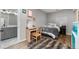 Bedroom showcasing a cozy bed, a desk and an ensuite bathroom at 24005 High Meadow Dr, Golden, CO 80401