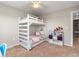 bedroom with bunk bed, white frame, and an adjacent bookshelf at 24005 High Meadow Dr, Golden, CO 80401