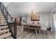 Bright dining room boasts wood floors, modern lighting, and a built-in buffet at 24005 High Meadow Dr, Golden, CO 80401