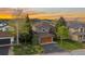 Beautiful home with mature trees and a two-car garage nestled in a serene neighborhood at 24005 High Meadow Dr, Golden, CO 80401