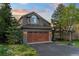 Charming two-story home with a well-manicured lawn and a two-car garage at 24005 High Meadow Dr, Golden, CO 80401