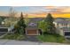 Charming home with lush lawn, mature trees, and a welcoming two-car garage at 24005 High Meadow Dr, Golden, CO 80401