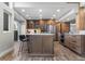 Well-appointed kitchen features a large island with counter seating and modern appliances at 24005 High Meadow Dr, Golden, CO 80401