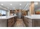 Spacious kitchen features stainless steel appliances, white countertops, wooden cabinets, and wood-look flooring at 24005 High Meadow Dr, Golden, CO 80401