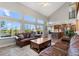 Bright living room features vaulted ceilings, many windows, and an open kitchen area at 24005 High Meadow Dr, Golden, CO 80401