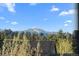 Scenic view of the mountains and lush greenery from the property at 24005 High Meadow Dr, Golden, CO 80401