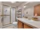 Bathroom featuring a glass shower, toilet, and a vanity with sink and mirror at 12317 Fillmore Ct, Thornton, CO 80241