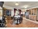 Inviting dining area with wood laminate flooring and built in cabinets at 12317 Fillmore Ct, Thornton, CO 80241