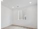 Bright bedroom featuring neutral walls, recessed lighting, and a large window for natural light at 24777 E 40Th Ave, Aurora, CO 80019
