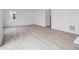 Spacious living room featuring natural light, recessed lights and wood-style flooring at 24777 E 40Th Ave, Aurora, CO 80019