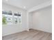 Bright living room with natural light, recessed lights, and wood-style flooring at 24777 E 40Th Ave, Aurora, CO 80019