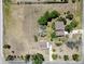 Overhead view of a property featuring multiple outbuildings and lush surroundings on a quiet road at 1808 Riverview Dr, Berthoud, CO 80513