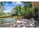 Outdoor back patio with an array of metal furniture, wood railing and a grill, perfect for relaxing and dining at 1808 Riverview Dr, Berthoud, CO 80513