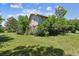 Expansive backyard surrounded by mature trees and lush greenery, offering a private and serene setting at 1808 Riverview Dr, Berthoud, CO 80513