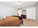 Bedroom featuring neutral paint and carpet, closet and dresser at 1808 Riverview Dr, Berthoud, CO 80513