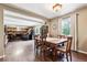 Bright dining area with open access to the living room and fireplace, perfect for a relaxed atmosphere at 1808 Riverview Dr, Berthoud, CO 80513