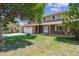 Charming two-story brick home with a well-manicured lawn and an attached two-car garage at 1808 Riverview Dr, Berthoud, CO 80513