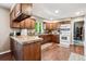 Well-equipped kitchen with oak cabinets, sleek appliances, and ample counter space for meal preparation at 1808 Riverview Dr, Berthoud, CO 80513