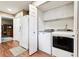 Convenient laundry room with ample storage and modern washer and dryer at 1808 Riverview Dr, Berthoud, CO 80513