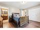 Comfortable main bedroom with wood floors, access to bathroom and closet space at 1808 Riverview Dr, Berthoud, CO 80513