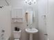 Cozy bathroom featuring a single sink vanity, toilet and shower with white tile surround at 11364 Xavier Dr # 205, Westminster, CO 80031