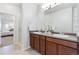 Bright bathroom featuring a double sink vanity, large mirror, and a walk-in shower at 11364 Xavier Dr # 205, Westminster, CO 80031