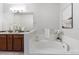 Inviting bathroom featuring a soaking tub, double sink vanity, and tasteful decor at 11364 Xavier Dr # 205, Westminster, CO 80031
