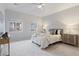 Comfortable bedroom with neutral tones, ceiling fan and bright windows with views to the outside at 11364 Xavier Dr # 205, Westminster, CO 80031